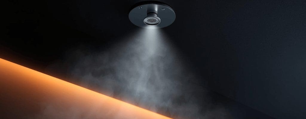 RAD Fire Sprinklers fire mist system nozzle releasing fine mist in a modern interior.